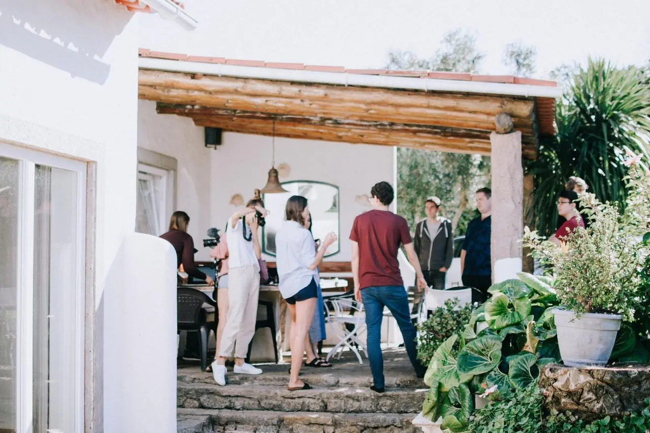 People gathered on the back patio of a home